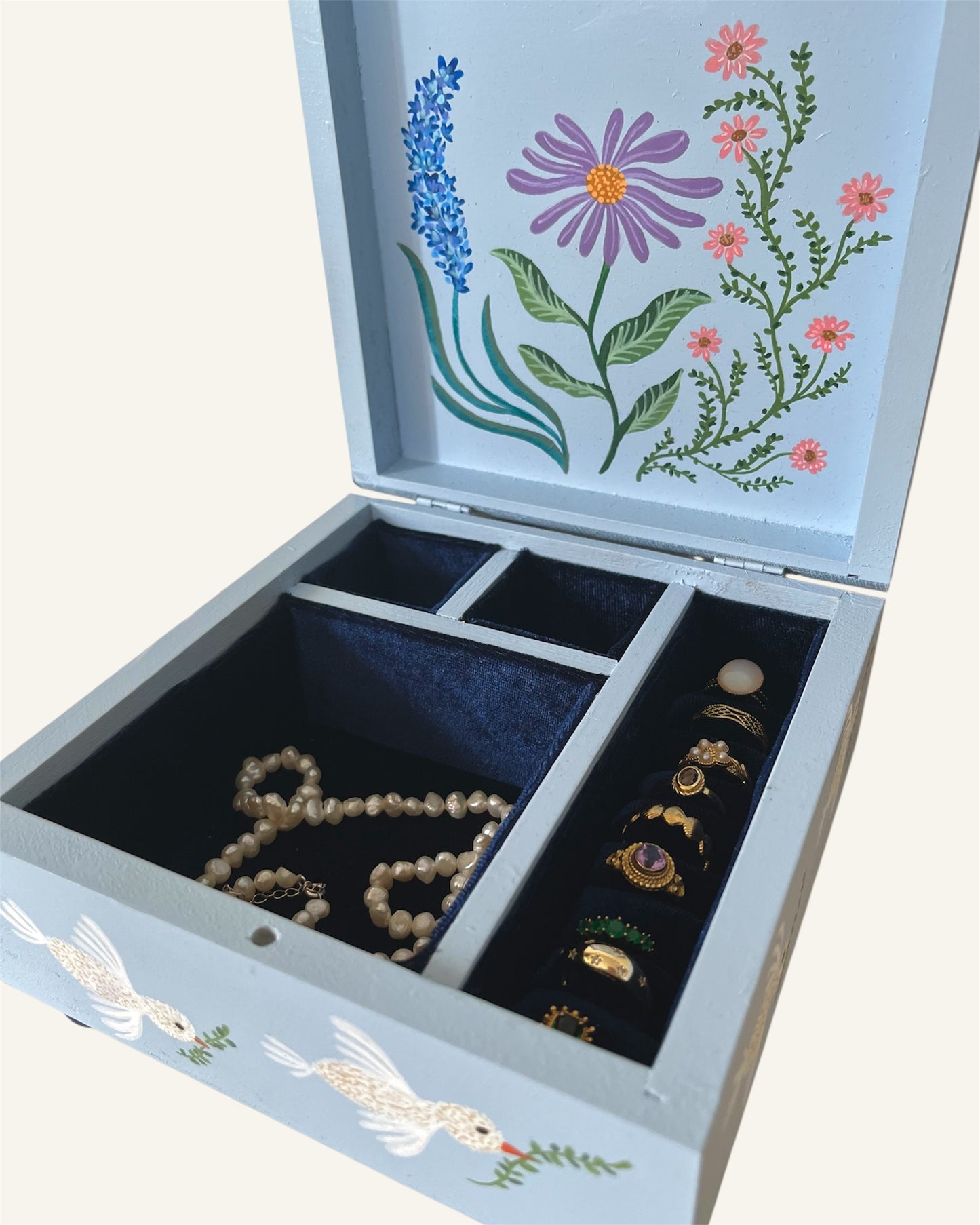 Inside of wooden handpainted jewerlybox blue navy velvet lining vintage golden jewelry