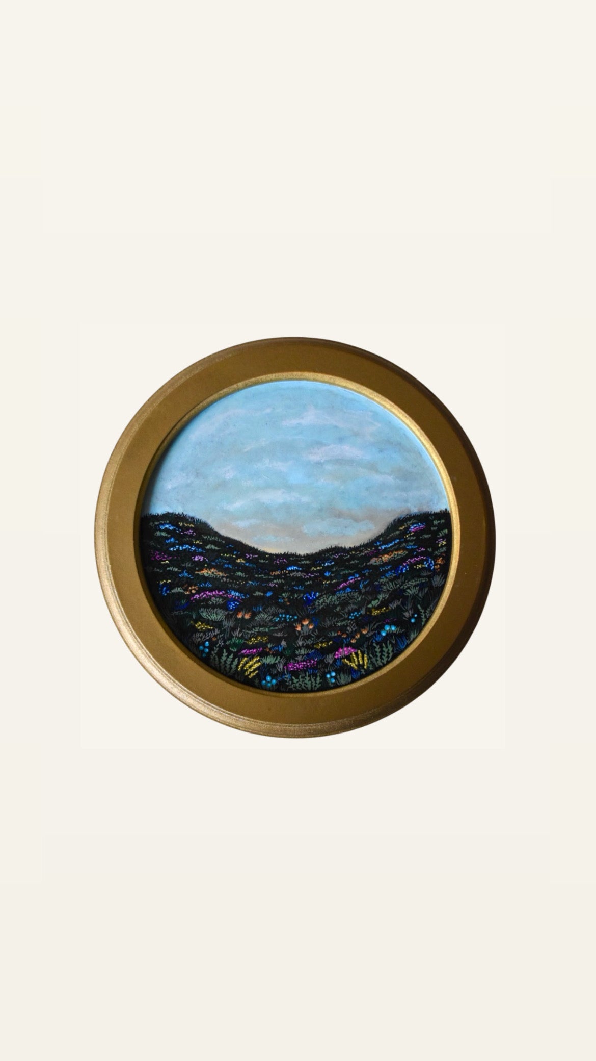 rond schilderij met bloemen landschap