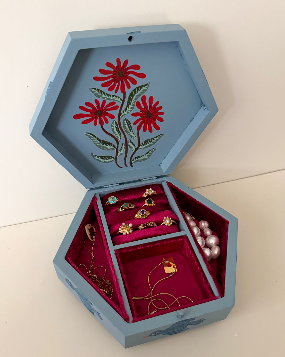 Blue jewelrybox with red velvet linning