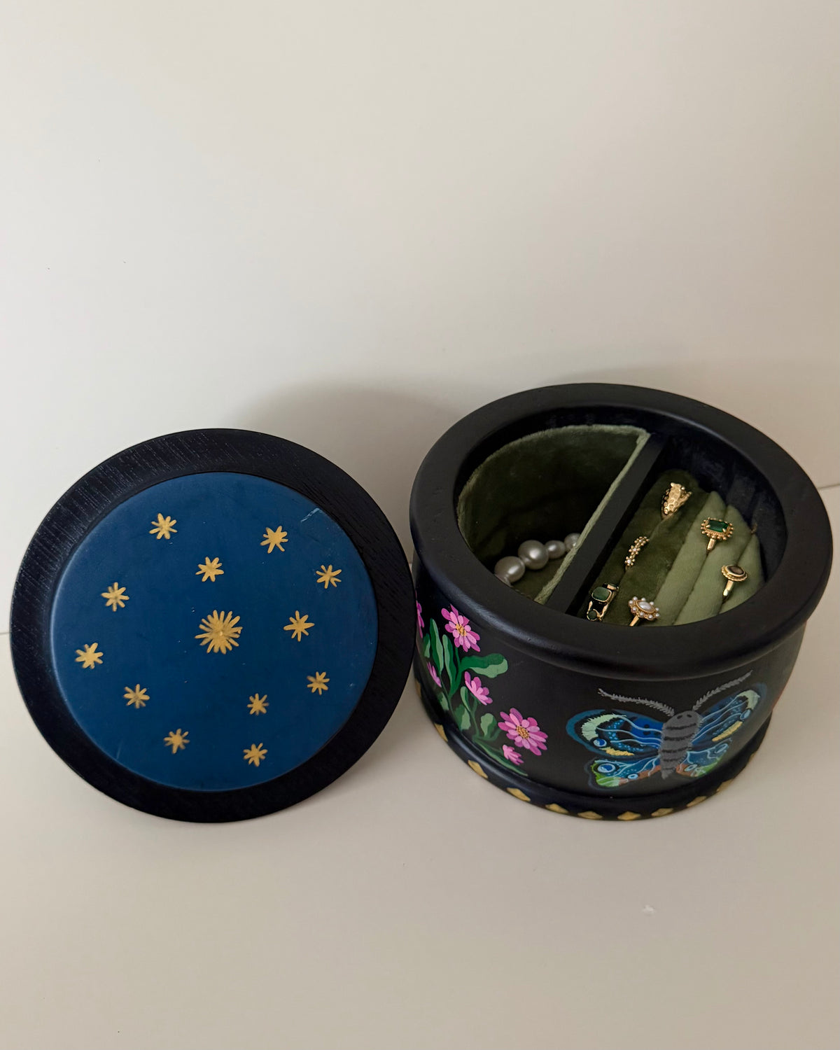 Black jewelrybox with colorful butterfly and flowers