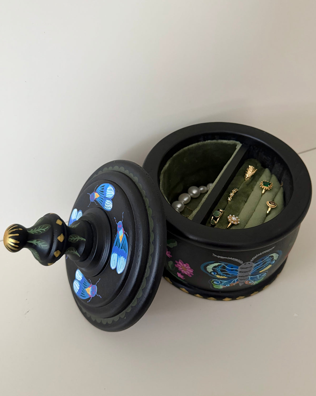 Black vintage jewelrybox with colorful illustrations 
