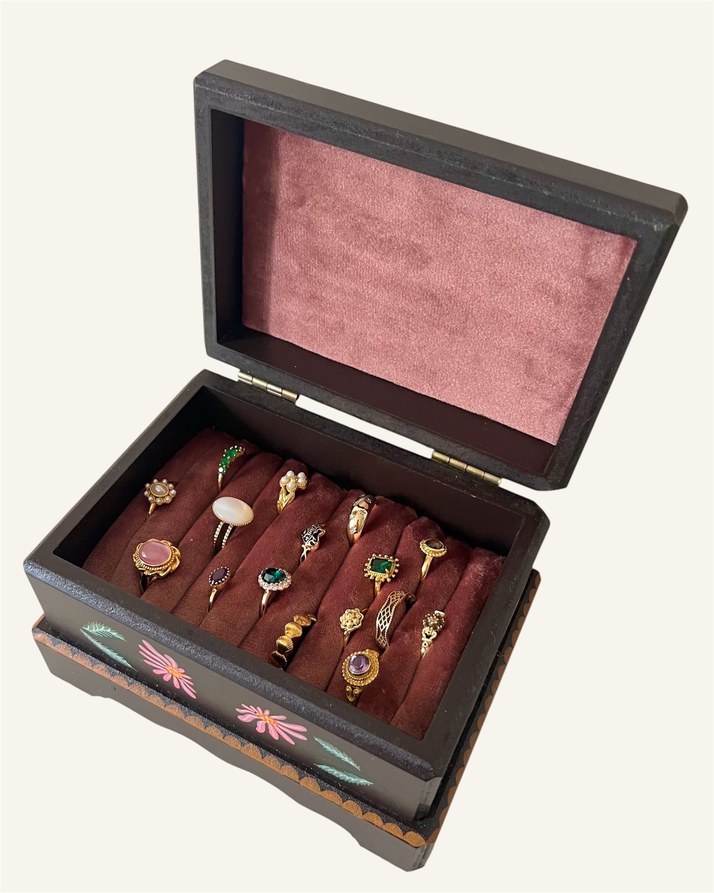 inside of brown ringbox with rose pink velvet lining for vintage golden jewelry 