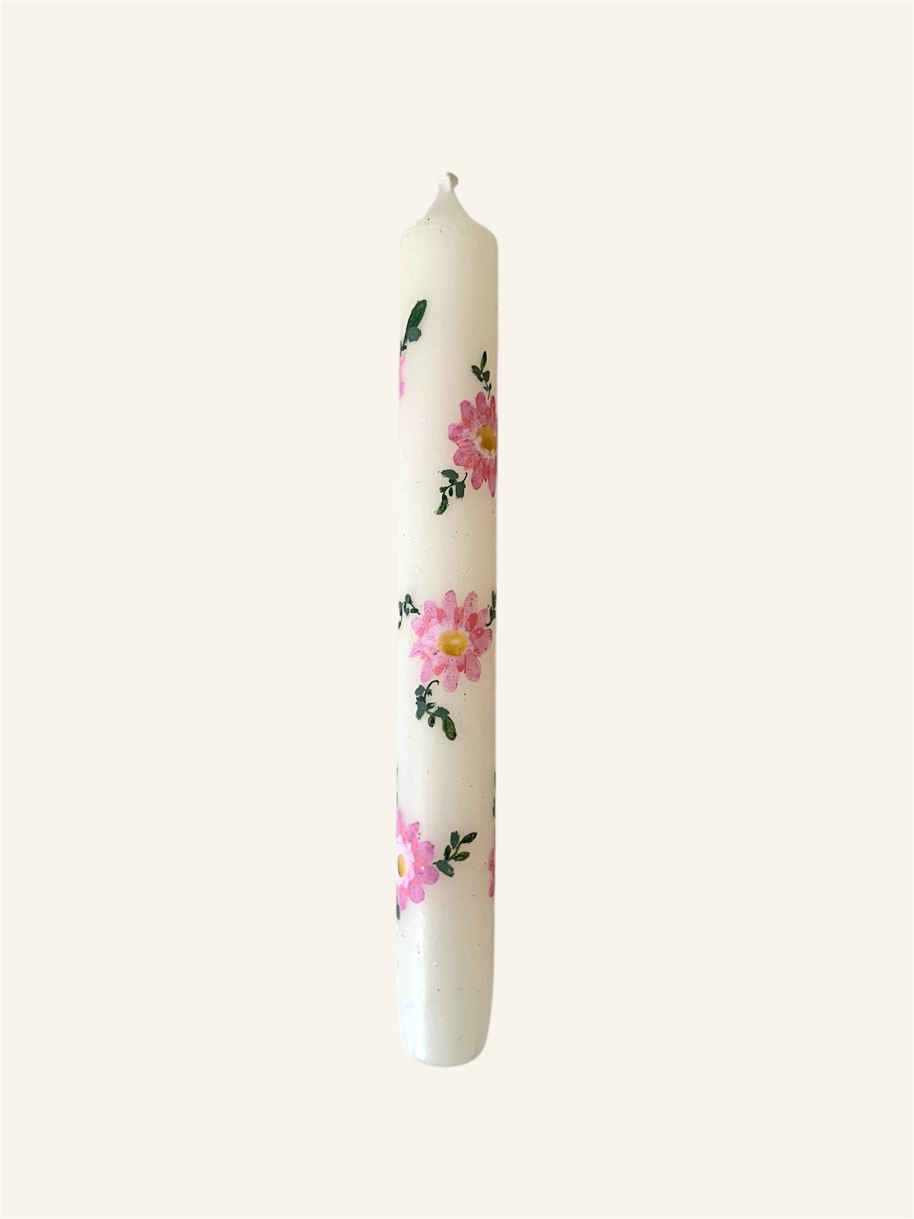 handbeschilderde kaars met roze bloemen en goudkleurige details 