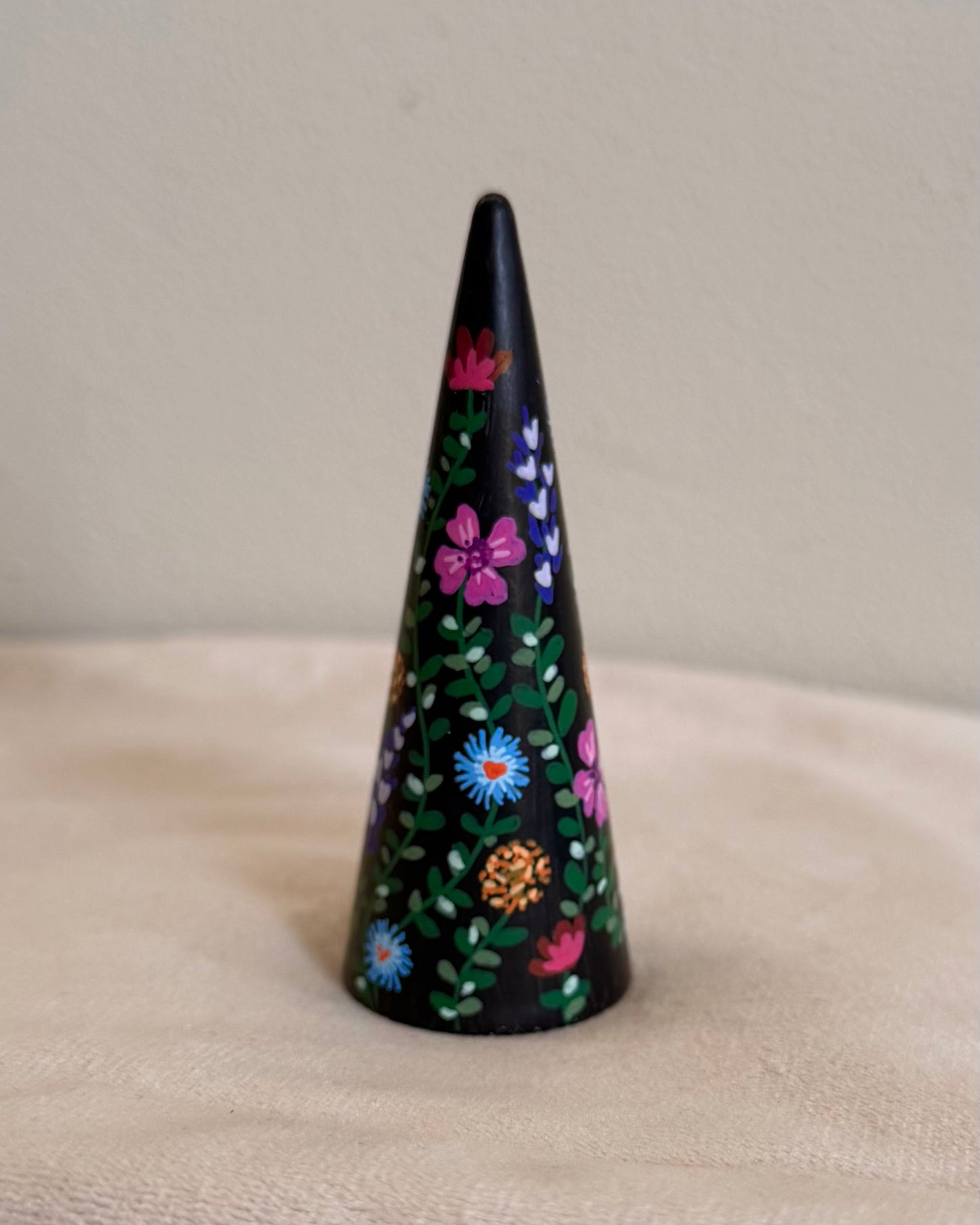black ringcone with colorful flowers in vibrant colors